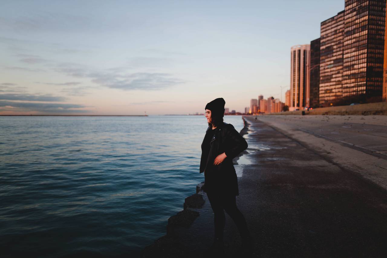 sea, ocean, blue, water, wave, coast, shore, horizon, people, alone, girl, woman, building, structure, city, architecture, sky, nature
, 