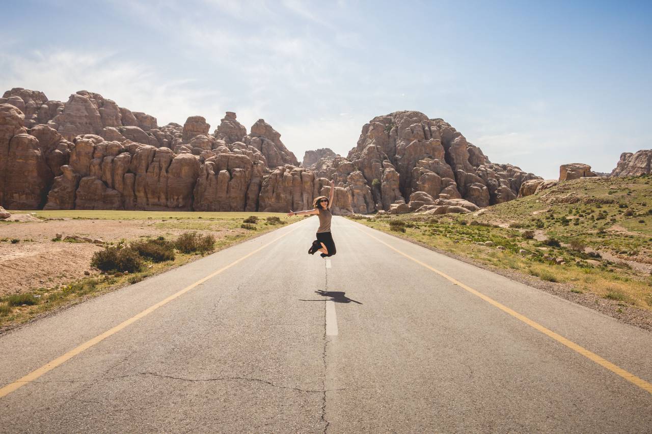 woman, girl, lady, people, jump, arms, raised, nature, rocks, canyon, grass, vegetation, road, street, path
, 