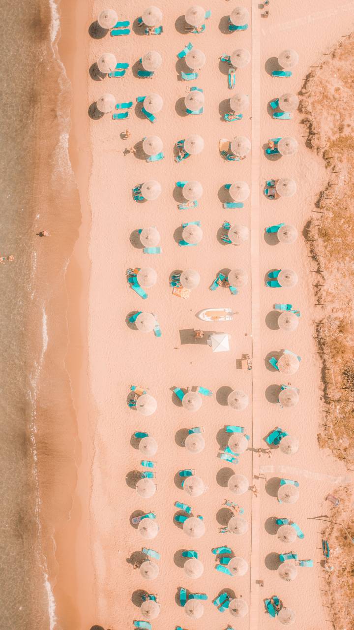 drone pov;beach;summer;Beach Umbrella,sand,summer,vacations,travel,nature,outdoors,coastline,water,tourism, 