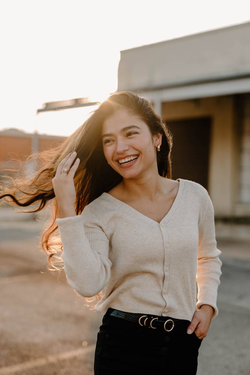 latin woman;25 years old;sunset;hair;wind,smiling,women,one person,young adult,outdoors,adult,lifestyles,happiness,young women,cheerful,females,one,woman,casual clothing,caucasian ethnicity,brown hair,only,toothy smile,looking at camera,beauty,real people,looking,one,young,woman,portrait,copy space,leisure activity, 