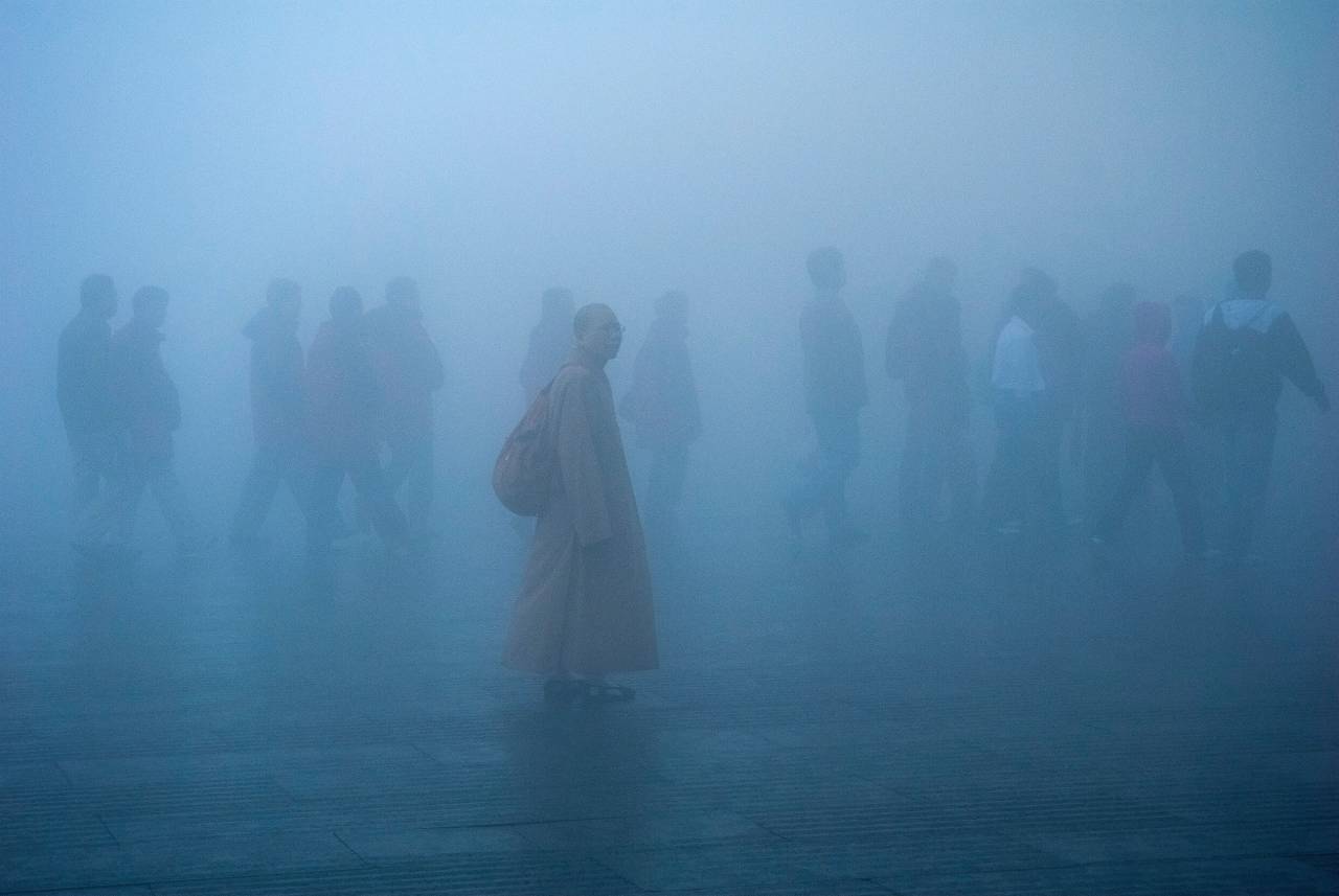 china;people;pollution;mist,fog,men,women,outdoors,nature,religion,walking,group of people,spirituality,adult, 