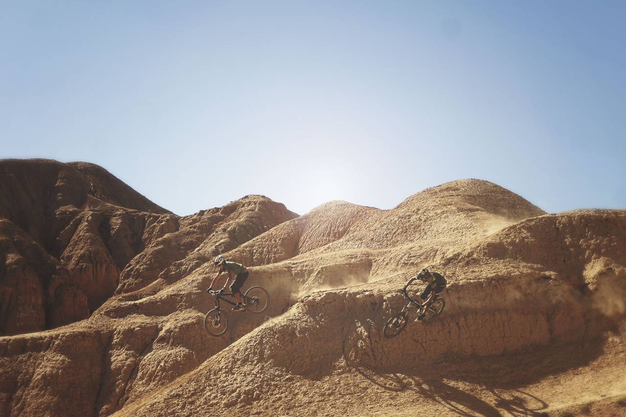 mountain, bike, bicycle, blue, sky, clouds, outdoor, adventure, people, cyclist, cliff, rock, landscape, racing, sport, game, fitness, exercise
, 