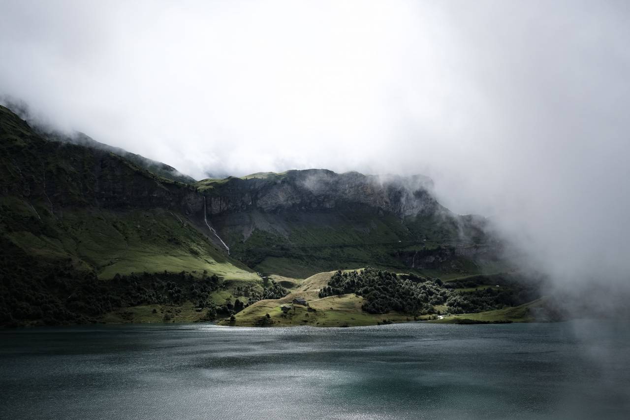 nature, coast, beach, shore, water, ocean, sea, rocks, lush, vegetation, grass, trees, sky, clouds, horizon, fog, eerie
, 