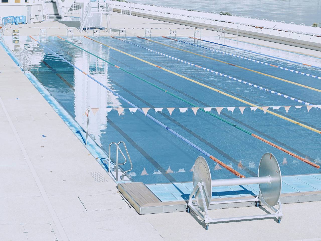 olympic pool, swimming, competition, blue water, racing lanes, starting blocks, diving board, world record, elite athletes, summer olympics, aquatic sports, fitness, healthy lifestyle, victory, teamwork, dedication, training, 