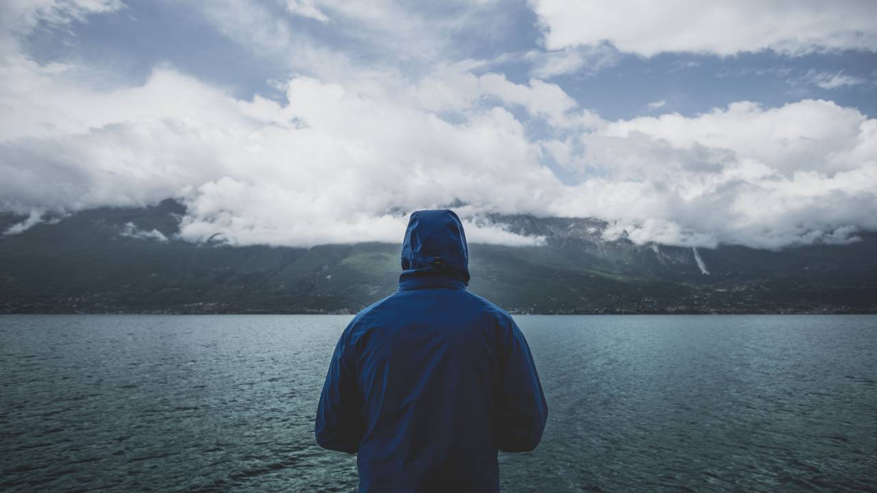 sea, ocean, water, dark, mountain, highland, view, landscape, nature, people, man, alone, hoodie, cloudy, sky, clouds
, 