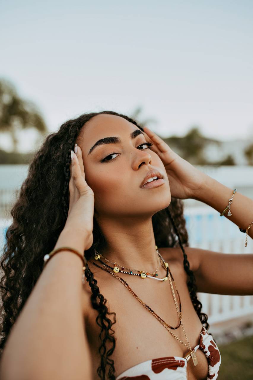 face,women,one person,adult,young adult,beauty,young women,one,woman,outdoors,lifestyles,females,summer,only,one,young,woman,fashion model,smiling,fashion,sensuality,portrait,brown hair,looking,looking at camera,caucasian ethnicity,nature,curly hair,casual clothing,beautiful people,african ethnicity,relaxation,elegance,happiness,long hair,necklace, 