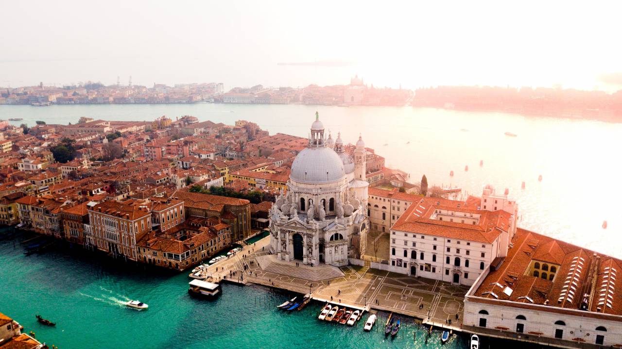 venice,famous place,cityscape,architecture,outdoors,water,building exterior,tourism,travel destinations,travel,aerial view,religion,urban skyline,nautical vessel,cultures,history,christianity,built structure,roof, 