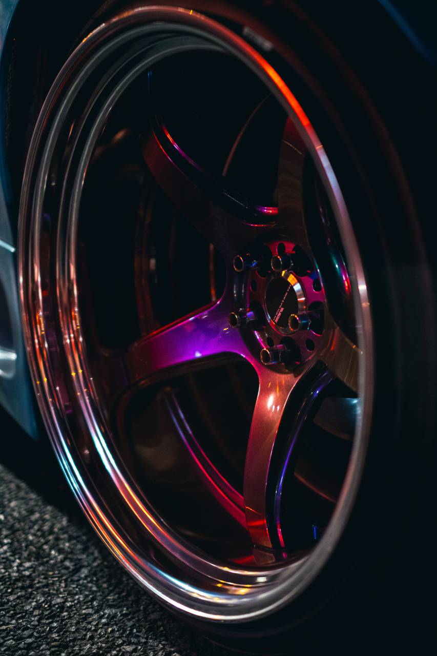 purple;tire;rim,close-up,wheel,shiny,backgrounds,abstract,metal,car,speed,circle, 