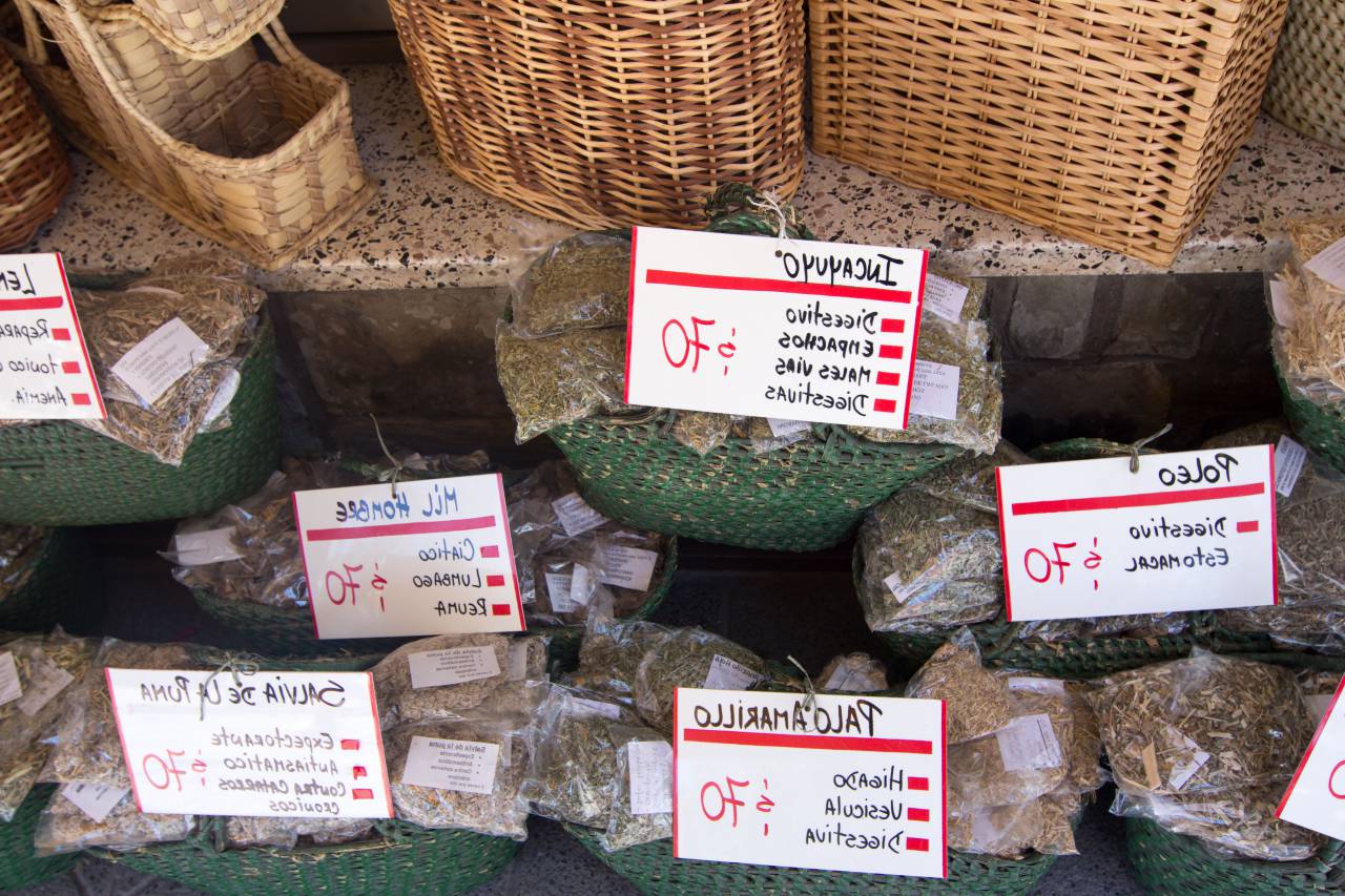 herbs, spices, natural, organic, sale, market, vendor, traditional, aroma, green, fresh, health, wellness, alternative medicine, healing, plants, leaves, dried, colorful, jars, display, shopping, outdoors, Argentina, Cordoba, 