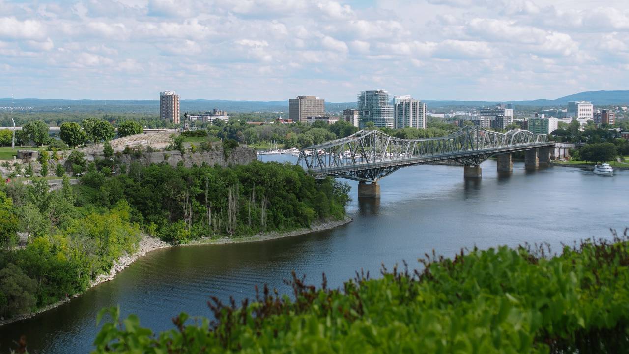 architecture, building, infrastructure, bridge, lake, water, trees, plants, green, grass, mountain, highland, sky, clouds
, 