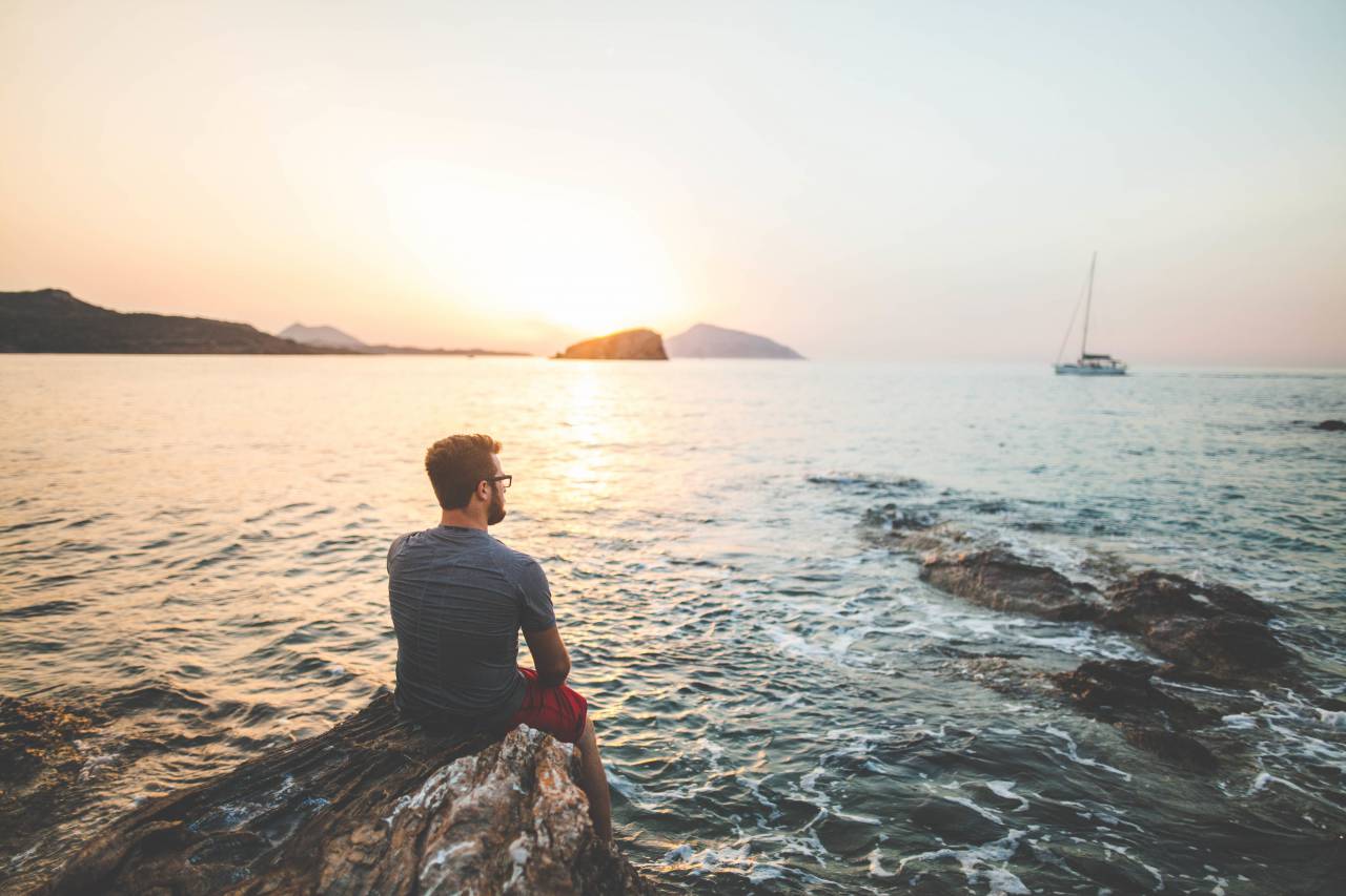 guy, man, people, sunset, dusk, sailboat, ocean, sea, water, rocks, shore, landscape, nature, horizon, mountains, view, looking
, 