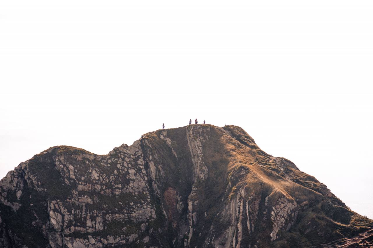people, man, woman, lady, guy, mountain, nature, climber, hiking, travel adventure, trip, view, sky, clouds, rock, formation, mountaineer, grass
, 