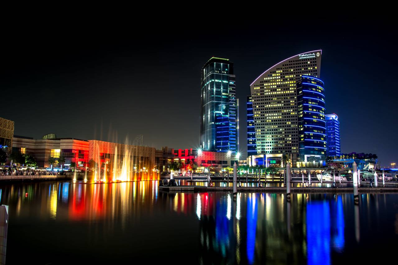water, water, liquid, fountain, display, show, reflection, lights, dark, night, boat, yacht, beach, building, infrastructure, establishment, city, urban, intercontinental, hotel, mall, people, man, woman, children, family
, 