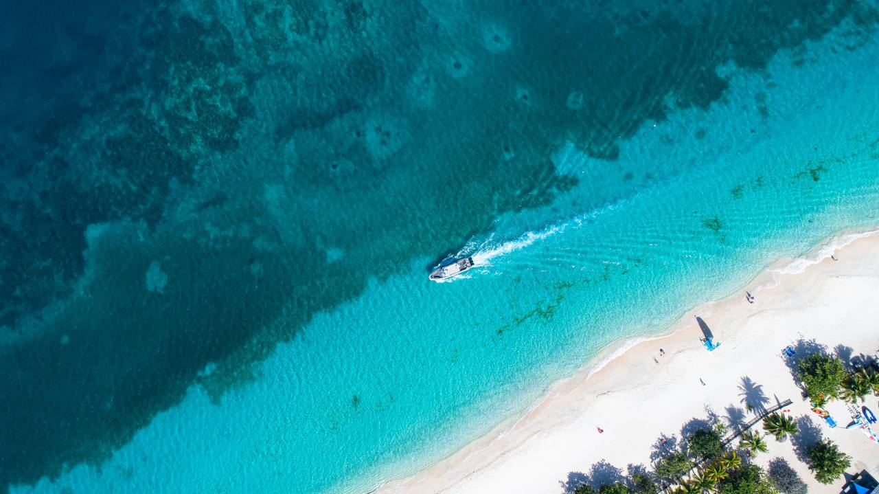 caribbean;drone pov,nature,blue,sand,summer,water,aerial view,vacations,coastline,travel,high angle view,landscape,travel destinations,wave,drone,tropical climate,outdoors,tourism, 