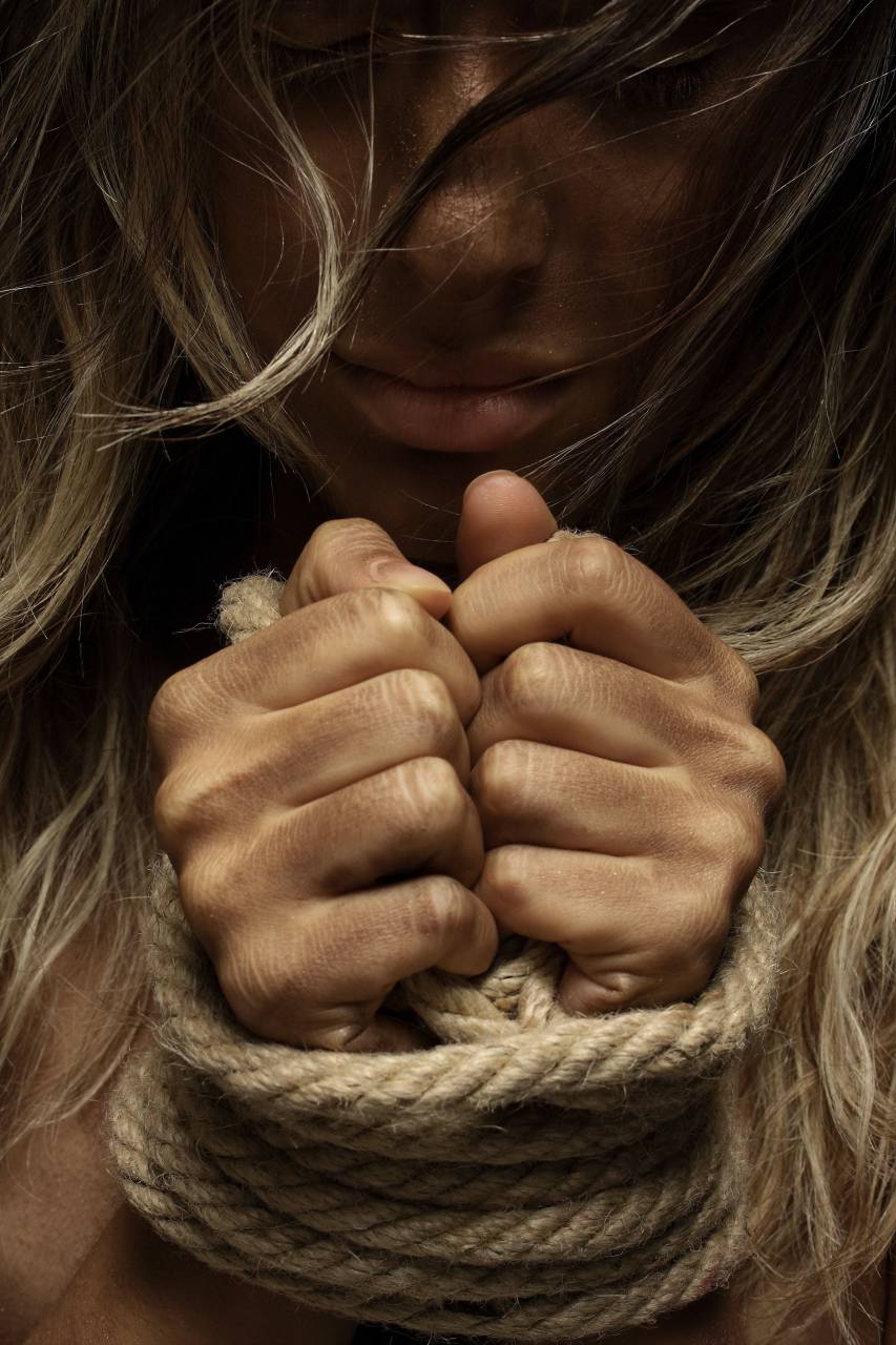 woman;prisioner;rope,women,one person,adult,caucasian ethnicity,young adult,close-up,human hand,females,beauty,blond hair,rope,studio shot,one,woman,portrait,young women,sensuality, 