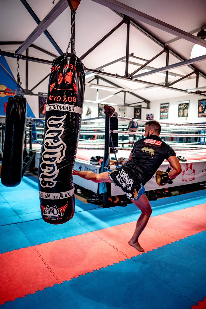 man;kickboxing,sport,men,athlete,competitive sport,exercising,competition,muscular build,strength,adult,sports training,gym, 
