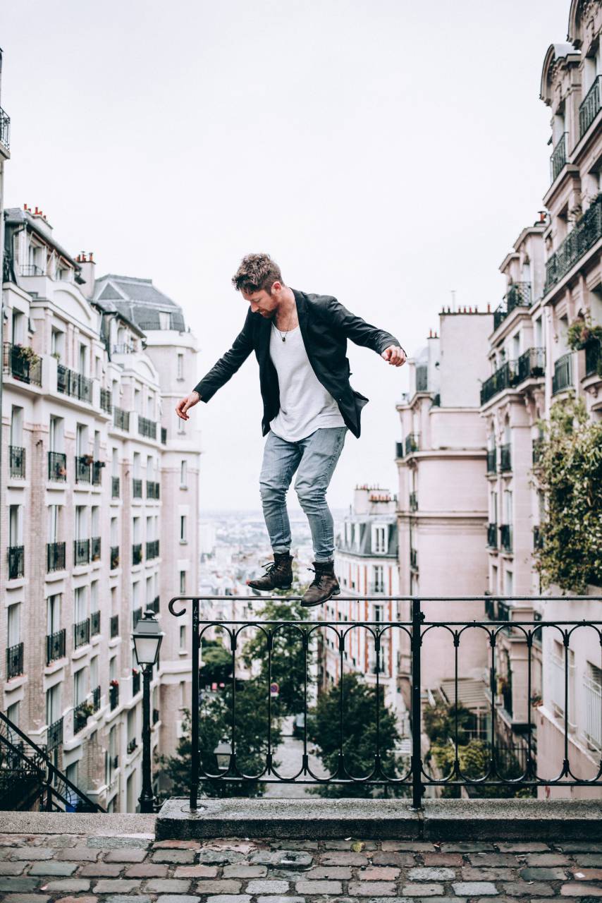 man, fashion, balancing, city, buildings, standing, person, architecture, outdoors, risk, daring, urban, stairs, cobblestone, male
, 