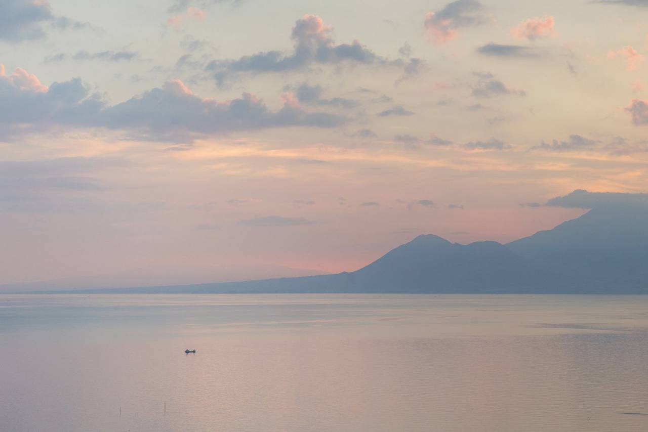 ocean, sunset, hills, mountains, sky, clouds, calm, reflection, pastel, landscape, waterscape, still, dusk, water, sun, boat
, 