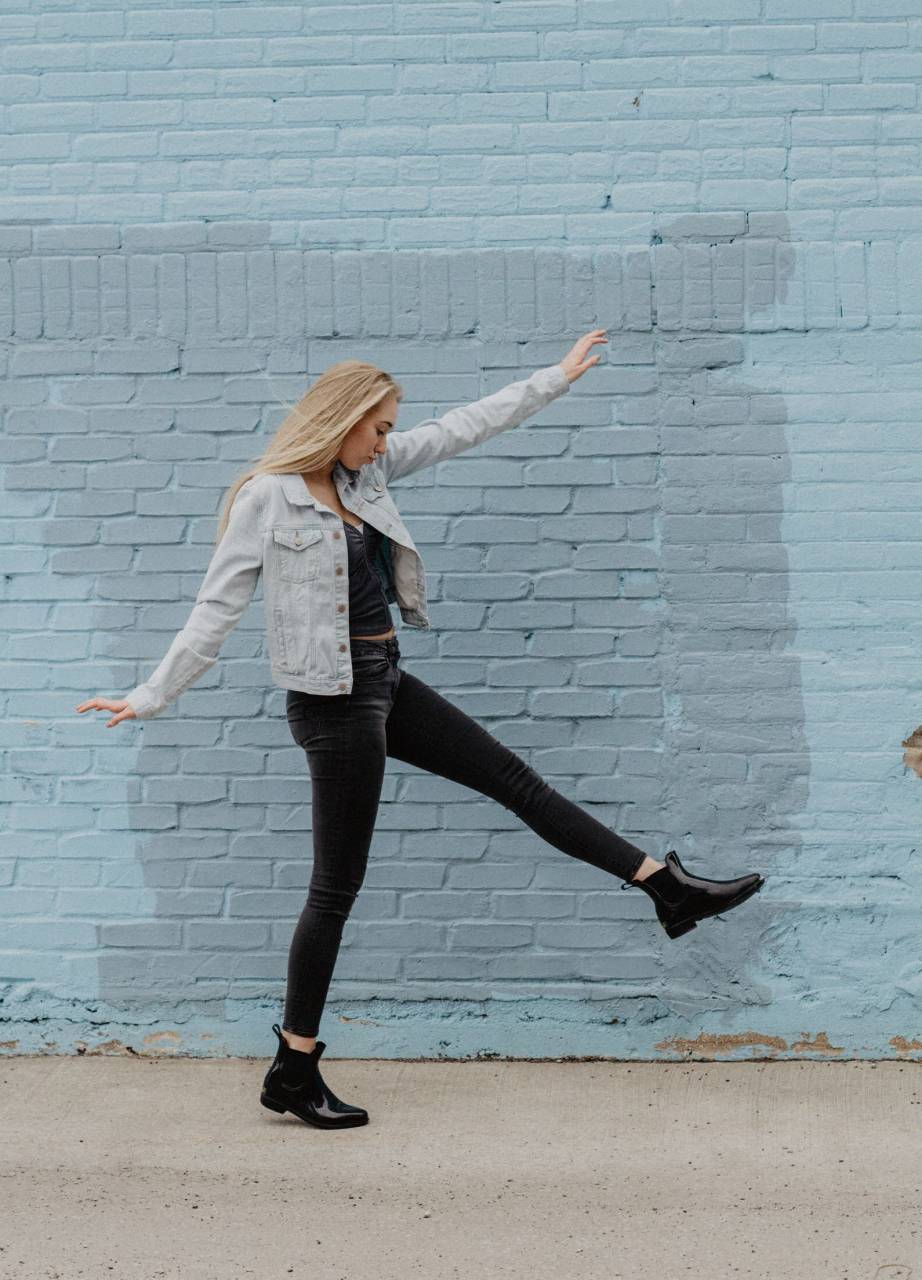 Young, Blonde, Woman, Dancing, Brick, Wall, Energetic, Joyful, Motion, Stylish, Casual, Happy, Expression, Urban, Fun, 
