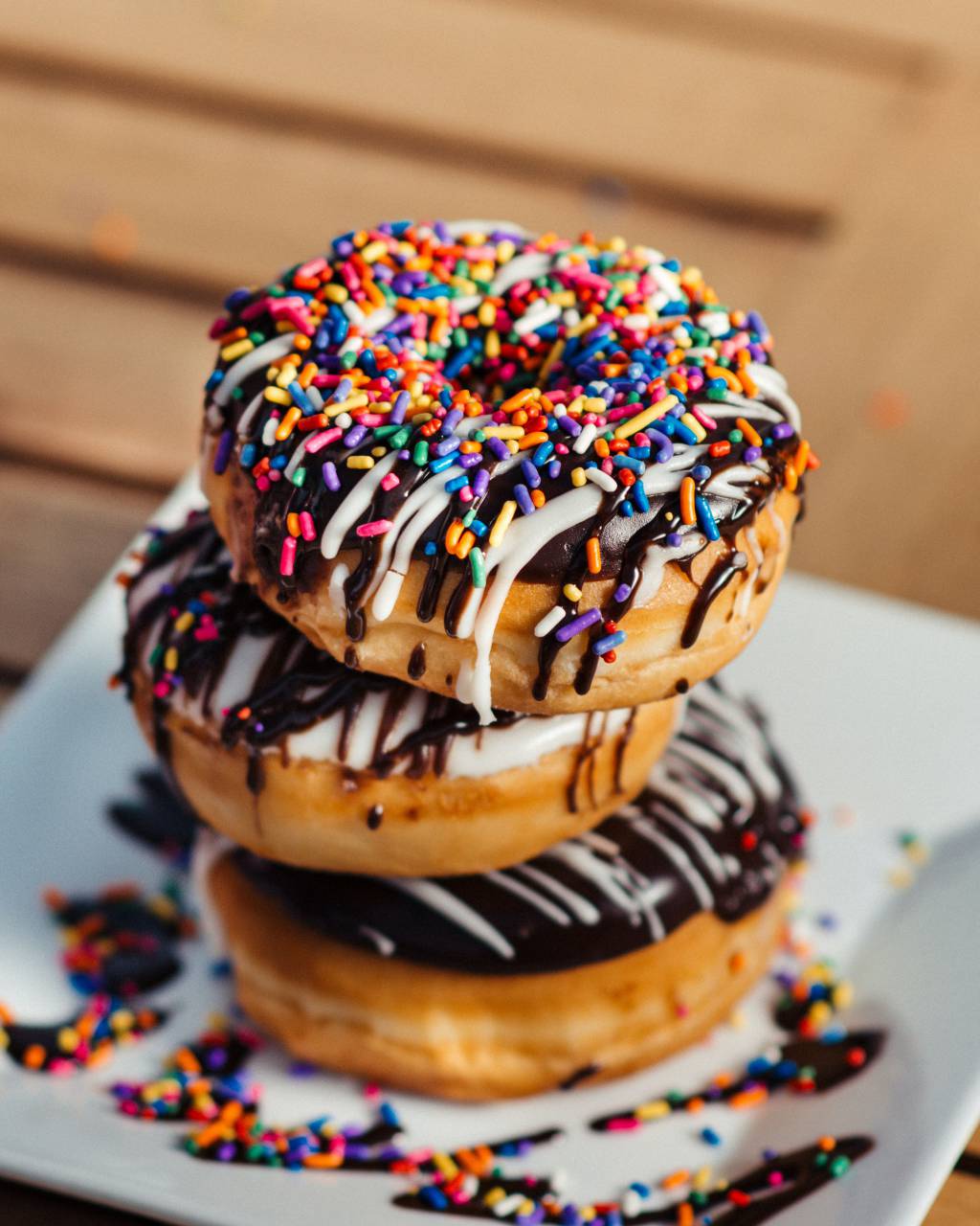 donuts,dessert,food,sweet food,gourmet,chocolate,close-up,donut,snack,unhealthy eating,sugar,refreshment,icing,multi colored,freshness,table,candy,plate,baked,backgrounds,eating, 