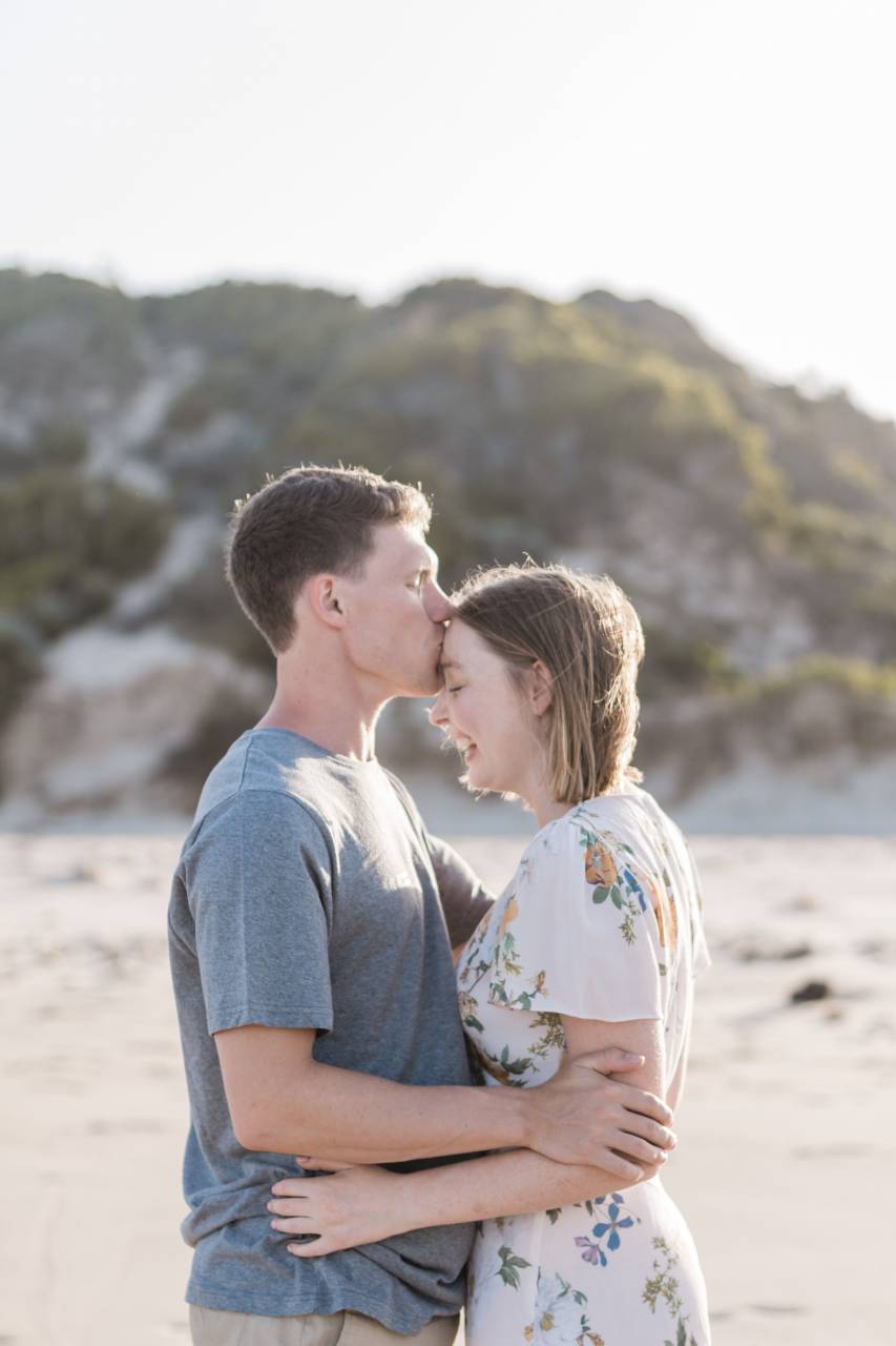 couple;kissing;beach,love,men,romance,heterosexual couple,lifestyles,women,outdoors,adult,embracing,smiling,togetherness,happiness,caucasian ethnicity,couple,relationship,summer,two,people,affectionate,males,nature,vacations,married,cheerful,bonding,husband,wife,leisure activity,casual clothing,relaxation,young adult,females,dating,kissing,copy space,enjoyment,young women,family,young couple,travel, 