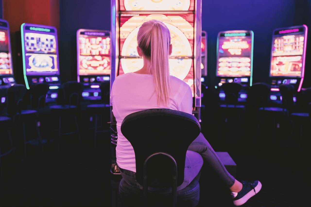 casino, slot machine, game, female, woman, luck, chance, lucky, play, blonde, people, slot, caucasian, style, black shirt, holding, portrait, tattoo girl, blonde hair, hands raised, fashion, machine, body paint, paper, short hair, arms, punk, hands, tattoo, person, young adult, photography, symbols, gambling, media, multimedia, icons, fun, risk, gamble, success, nightlife, video, illustration, fortune, video camera, player, technology, roll, smart phone, 