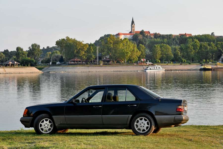 car, castle, ?landscape?, river boat, summer 