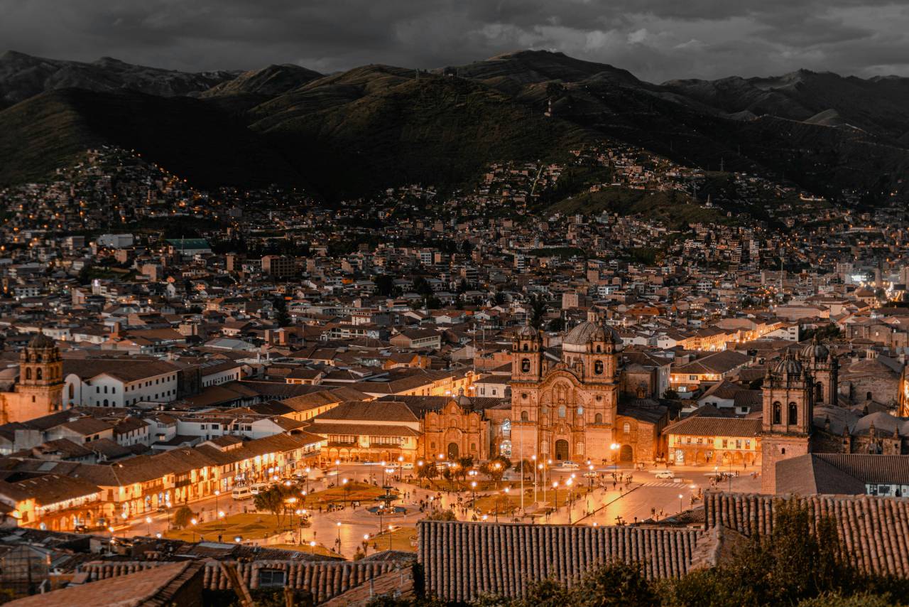Cusco at night, Cusco cityscape, Peru night view, illuminated city, Andean city, night photography, colonial architecture, historic city, travel Peru, South America city, night lights, city lights, urban landscape, Cusco skyline, nightscape, UNESCO heritage site, mountain city, ancient city, Inca capital, city at dusk, glowing city, historic town, architecture at night, Peru tourism, nighttime view, high altitude city, scenic night view, cultural destination, twilight city, old town Cusco, latinamerican, 