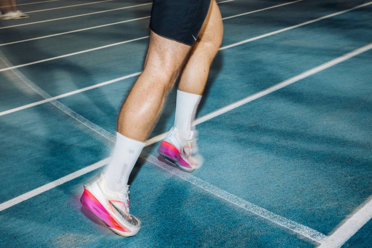athlete legs, running legs, sports action, runner, sprinting, athletic performance, muscular legs, motion blur, speed, track and field, fitness, endurance, training, sportswear, powerful stride, athlete in motion, running shoes, fast movement, sport legs, determination, exercise, cardio, race, runner close-up, fitness photography, human legs, outdoor workout, competitive running, strength, running action, lower body athlete, 