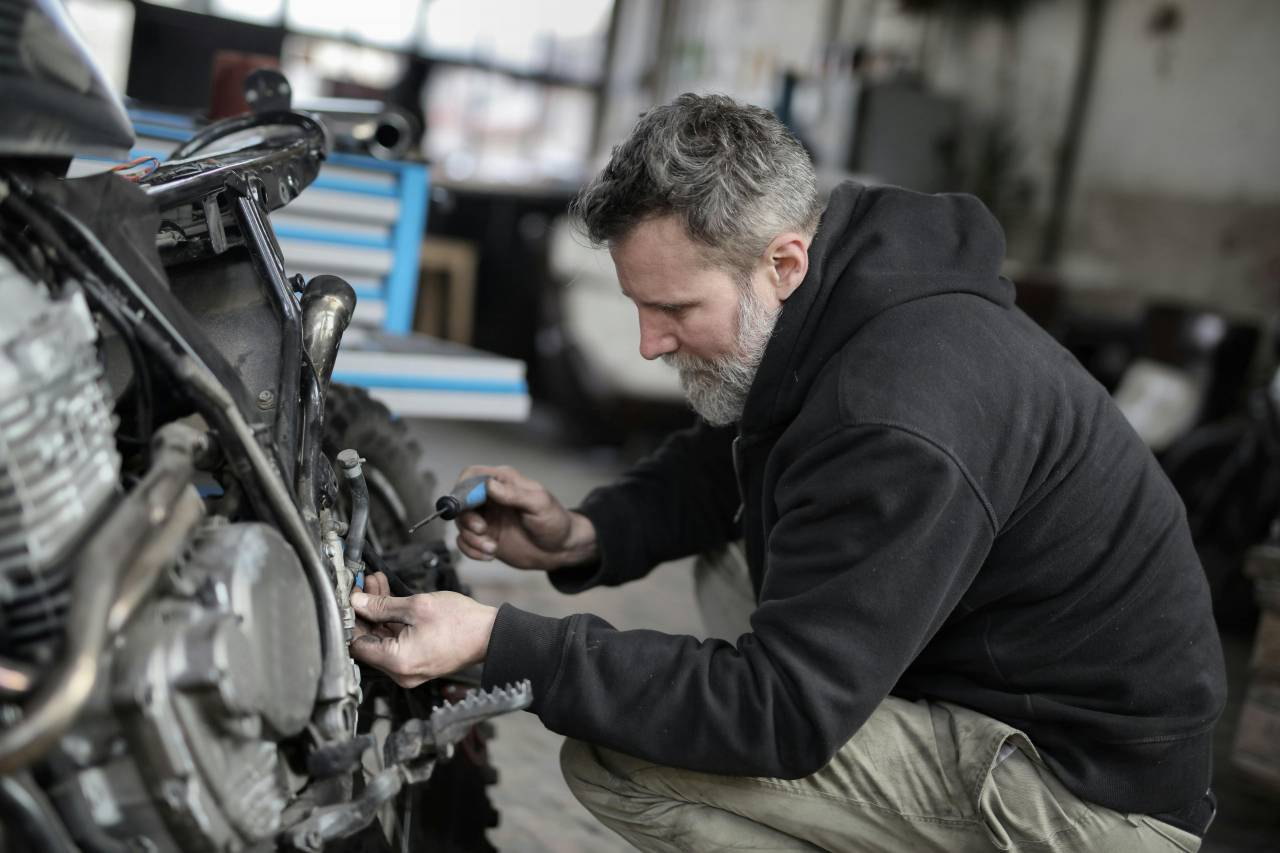 mechanic, repairing, motorcycle, engine, workshop, tools, maintenance, vehicle, hands-on, garage, skilled, repair, machinery, technical, equipment, service, 