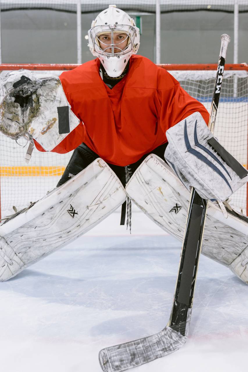 helmet, stick, goalkeeper, sport, hockey, equipment, winter, goal, game, puck, ice, team, player, athlete, white, professional, skate, play, background, uniform, goalie, competition, action, protection, mask, rink, person, skating, glove, people, net, red, graphic, sports, black, design, symbol, skill, man, isolated, goaltender, abstract, icon, motion, sign, stadium, 