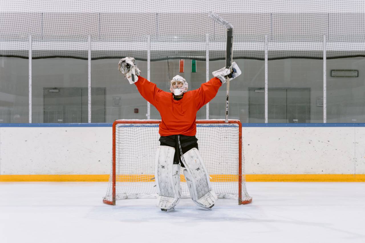 helmet, stick, goalkeeper, sport, hockey, equipment, winter, goal, game, puck, ice, team, player, athlete, white, professional, skate, play, background, uniform, goalie, competition, action, protection, mask, rink, person, skating, glove, people, net, red, graphic, sports, black, design, symbol, skill, man, isolated, goaltender, abstract, icon, motion, sign, stadium, 