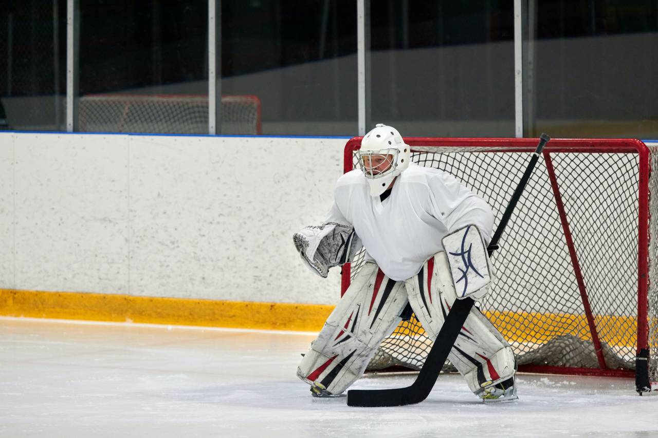 helmet, stick, goalkeeper, sport, hockey, equipment, winter, goal, game, puck, ice, team, player, athlete, white, professional, skate, play, background, uniform, goalie, competition, action, protection, mask, rink, person, skating, glove, people, net, red, graphic, sports, black, design, symbol, skill, man, isolated, goaltender, abstract, icon, motion, sign, stadium, 