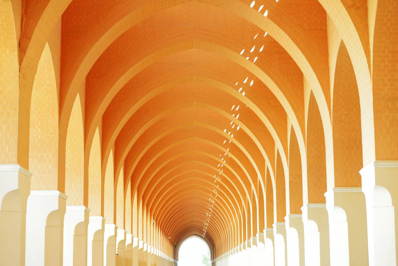 Orange Corridor, Arab Architecture, Arches, Cultural Heritage, Ornate, Intricate Design, Islamic Art, Historical, Architectural Beauty, Middle Eastern Influence, Vibrant Colors, Exquisite Details, Aesthetic, Cultural Identity, Decorative, Unique, Timeless, Geometric Patterns, Elegance, Artistry, Arabesque, 