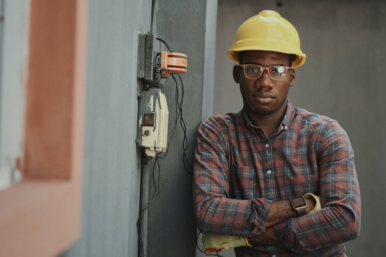 construction worker,men,occupation,working,engineer,adult,one person,construction industry,hardhat,males,construction worker,industry,work helmet,professional occupation,protective workwear,indoors,equipment,construction site,looking at camera,one,man,work tool,technology,building contractor,expertise,machinery,caucasian ethnicity,electricity,repairman,technician, 