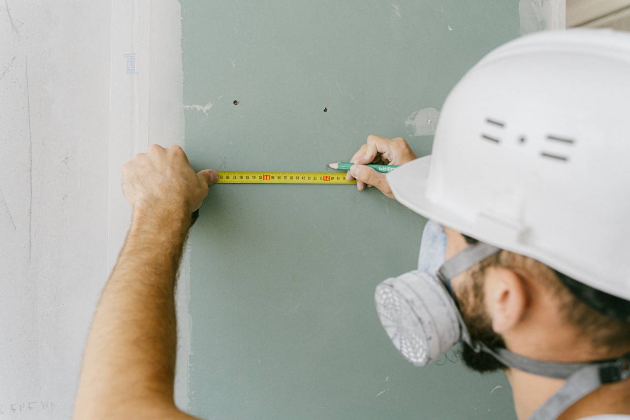 construction worker,construction industry,men,working,occupation,construction worker,adult,carpenter,construction site,caucasian ethnicity,males,hardhat,indoors,industry,work tool,one person,craftsperson,building contractor,engineer, 