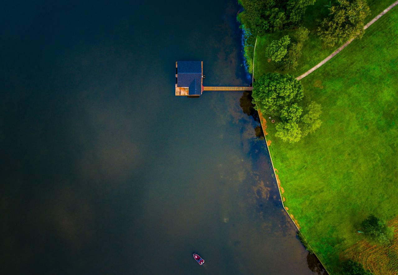 aerial, view, green, grass, trees, blue, lake, water, boat, sailing, pathway, house, roof
, 