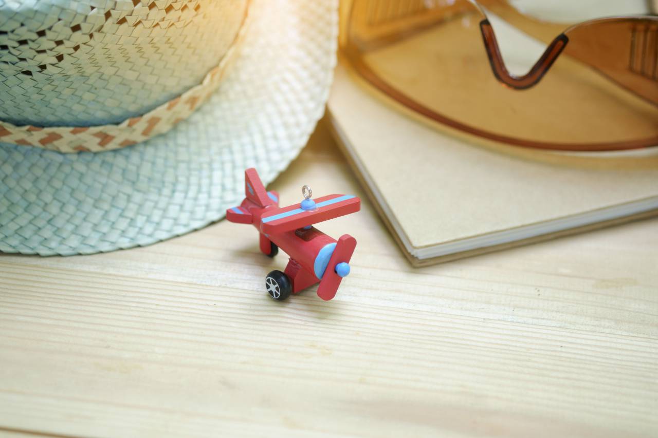 airplane, toy, eyeglasses, hat, cap, table
, 