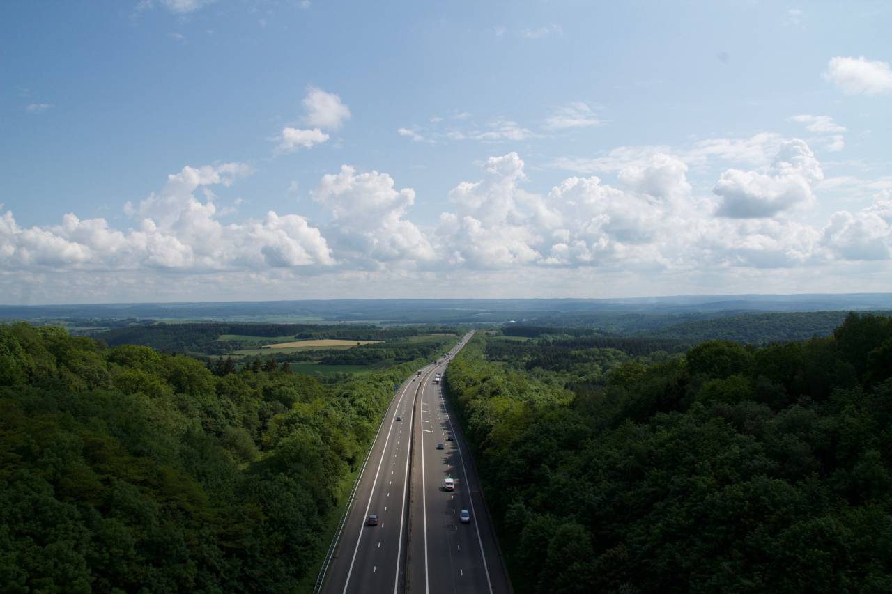 freeway, lane, posts, lights, trees, clouds, sky, vehicle, cars, road, path
, 