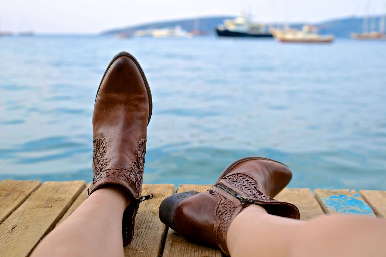 people, woman, boots, leather, brown, dock, wood, water, ocean, sea, boat, ship
, 