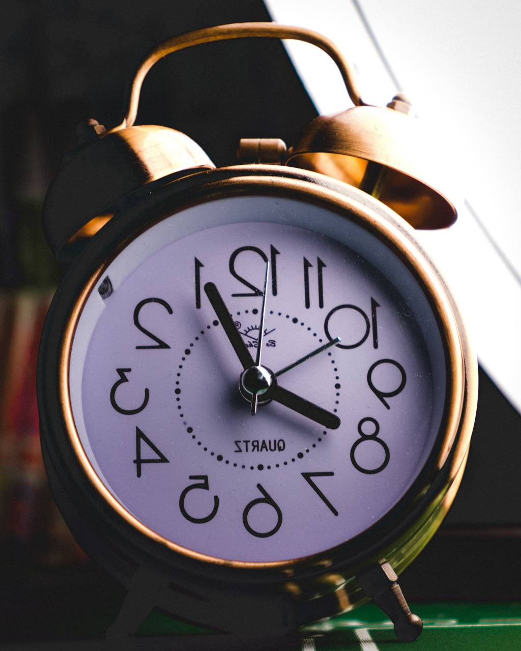 Alarm clock, Close up, Timepiece, Morning routine, Wake-up call, Time management, Digital display, Clock face, Bedside table, Wakefulness, Time awareness, Timekeeping, Analog clock, Clock hands, Ticking, Deadline, Punctuality, Sleep cycle, Hour hand, Minute hand, Ringing alarm, Time urgency, Countdown, Scheduled wake-up, Clockwork mechanism, Clock, 