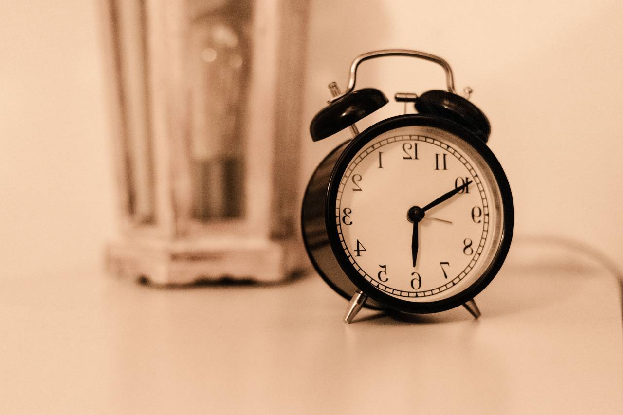 Alarm clock, Close up, Timepiece, Morning routine, Wake-up call, Time management, Digital display, Clock face, Bedside table, Wakefulness, Time awareness, Timekeeping, Analog clock, Clock hands, Ticking, Deadline, Punctuality, Sleep cycle, Hour hand, Minute hand, Ringing alarm, Time urgency, Countdown, Scheduled wake-up, Clockwork mechanism, Clock, 
