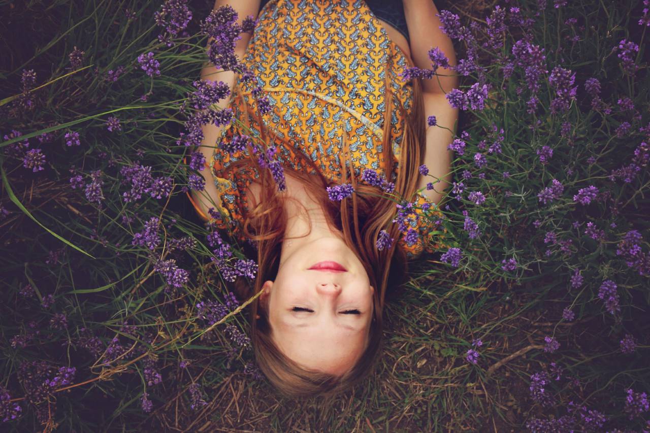 Woman, Eyes closed, Lying, Outdoors, Relaxing, Nature, Tranquility, Serene, Restful, Peaceful, Leisure, Calm, Closed eyes, Outdoor lifestyle, Daydreaming, Meditation, Fresh air, Beauty, Natural setting, Reclining, Contentment, Horizontal, Harmony, Sunlight, Outdoor relaxation, flowers, 