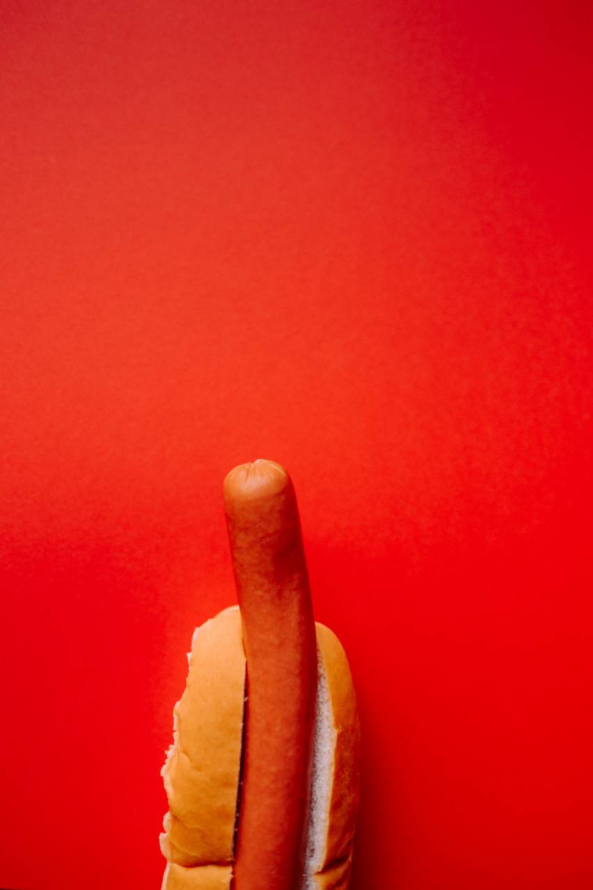 hot dog;red;background,food,close-up,gourmet,sweet food,snack,dessert,backgrounds,freshness,refreshment, 