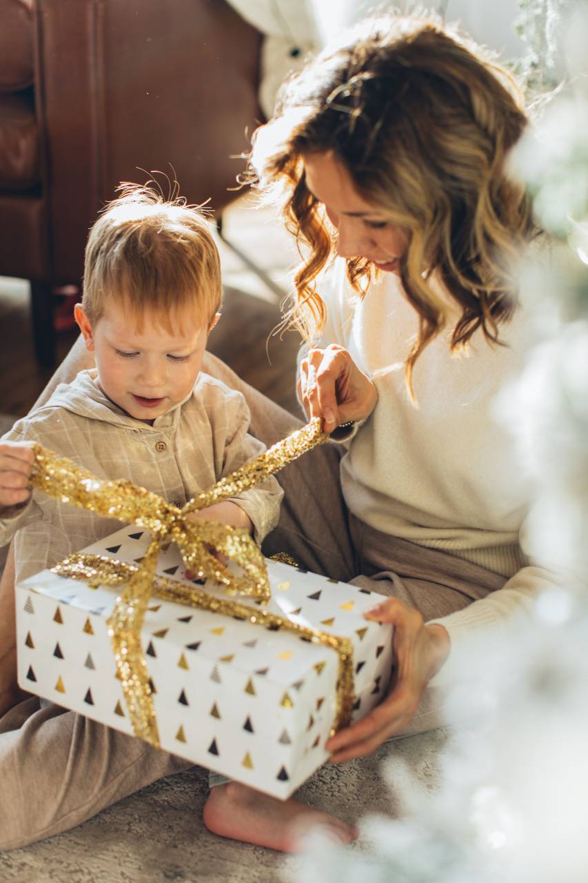 boy, gift, holiday, home, family, christmas, woman, mother, child, present, celebration, kid, man, father, happy, people, xmas, surprise, son, young, fun, christmas tree, decoration, sitting, together, love, tree, box, winter, santa, open, opening, red, celebrating, tradition, smiling, new year, hygge, indoors, parents, smile, small, festive, caucasian, background, person, togetherness, happiness, adult, year, 