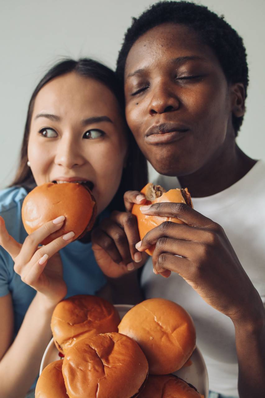 food, burger, fast, hamburger, people, unhealthy, woman, sandwich, person, young, lifestyle, beautiful, happy, eating, female, fun, meal, girl, background, diet, american, holding, portrait, fastfood, snack, junk, healthy, adult, smiling, cheeseburger, face, eat, nutrition, dinner, fat, human, hand, dieting, beauty, tasty, white, real people, women, biting, hair, casual, pretty, caucasian, 